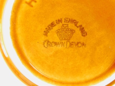 A Crown Devon treacle glazed pottery cruet set, comprising an apple sauce pot with wooden lid, mint sauce pot, sauce boat, salt, pepper, and mustard, printed marks, all on wooden stands. - 2