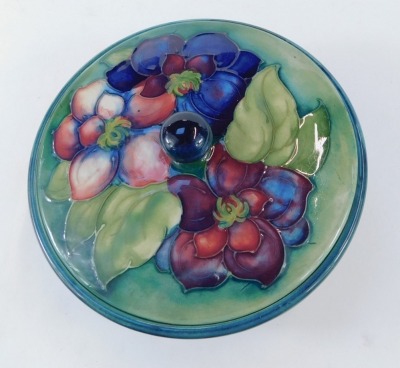 A Moorcroft pottery Clematis pattern bowl and cover, with a transitional blue to green ground, signed W Moorcroft, impressed marks, 16cm diameter. - 4