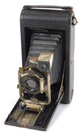 An Eastman Kodak Autographic No 3-A folding pocket camera, with outer case, together with a Kodak portrait attachment No 5. (2)