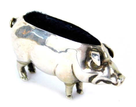 An Edward VII silver pin cushion modelled as a pig, maker H V Pithey & Co, Birmingham 1906, 5cm wide.