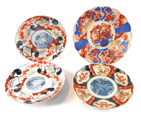 Four Chinese Imari plates, variously decorated.