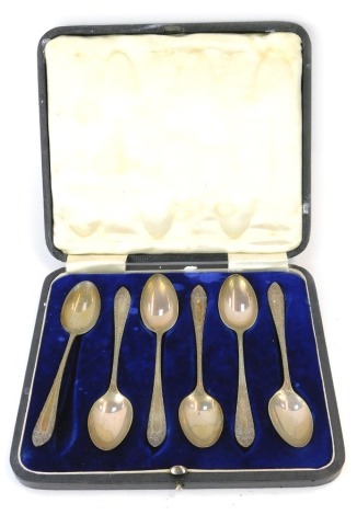 A set of six George V silver coffee spoons, each with a scroll decoration, makers stamp J D & S, Sheffield 1918, 2.97oz, in fitted case.