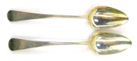 Two George III silver Old English pattern serving spoons, each bearing the initial J M B, London 1796 and 1815, 3.57oz. (2)