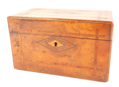 A Victorian walnut and satinwood banded tea caddy, of rectangular section, the hinged lid opening to reveal twin lead lined compartments, with key, 13cm high, 22cm wide, 12.5cm deep.