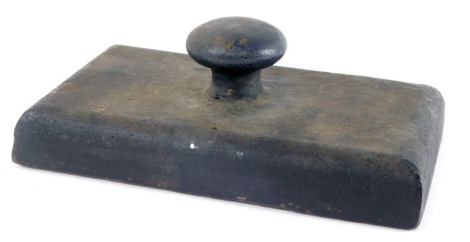 A Victorian cast iron desk paperweight, of rectangular form, 15cm wide.