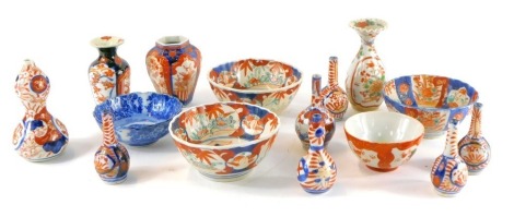 A group of Chinese and Japanese Imari bowls and vases, and a blue and white bowl. (a quantity)