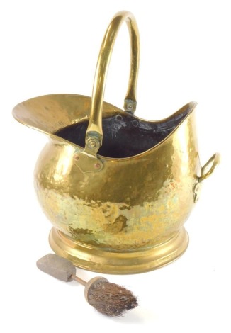 A Victorian brass helmet shaped coal scuttle, 36cm wide.