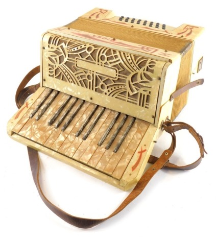 A 1930s Riosa piano accordion, twenty four button, with a faux mother of pearl case, 34cm wide.