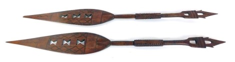 Tribal art. Two carved hardwood paddles, 115cm long. (2)