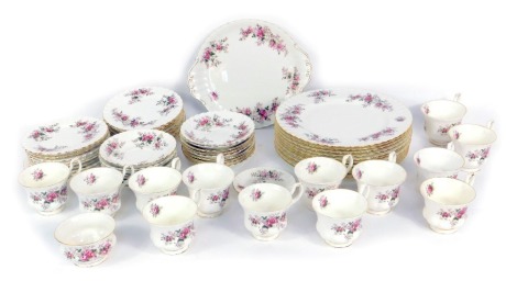 A Royal Albert Lavender Rose pattern tea and dinner service, comprising ten dinner plates, cake plate, fourteen teacups, seventeen saucers, one coffee can saucer, twenty two side plates. (1 tray and a quantity)