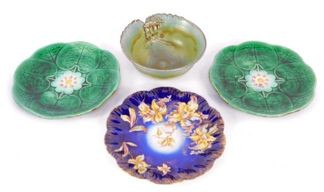 Mixed ceramics, comprising a studio pottery bowl inscribed Gyprun E7, two Wedgwood dark green leaf majolica plates, and a W and E Corp Orchid pattern cabinet plate. (4)