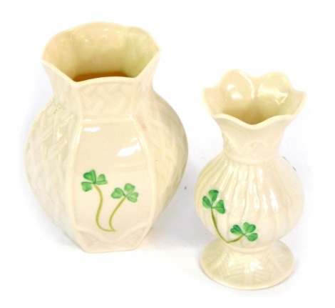 Two Belleek Shamrock pattern porcelain vases, Celebrating 150th Years, one with hexagonal rimmed top, 11cm high, and another with fluted top, 10cm high. (2)