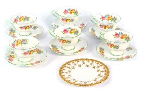 A set of six Shelley cups and saucers, each with a floral pattern and green border, and a Spode side plate with gilt decoration.