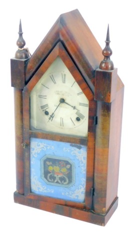 A late 19thC Abrahamson Bros of Liverpool mahogany cased mantel clock, circular tin dial bearing Roman numerals, J C Brown American eight day movement with coil strike, the case of architectural form, door with lower glass panel decorated with bowl of fru