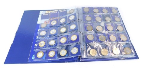 A collection of two pound, one pound, and fifty pence coins, including Shakespeare Tragedies, Olympics Centenary, Mary Rose, Florence Nightingale, and Action Union two pounds, Kew Gardens, Beatrix Potter, Peace Prosperity and Friendship With All Nations f