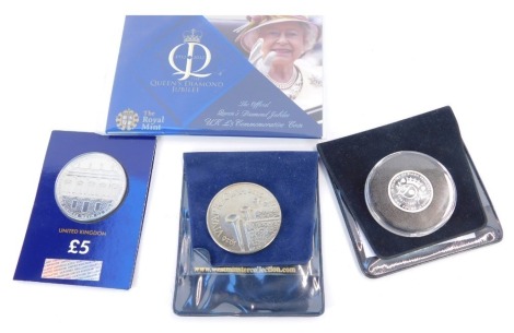 A Royal Mint Official Queen's Diamond Jubilee five pound commemorative coin 2012, 80th Birthday five pound coin 2006, Royal Academy of Arts five pound coin 2018, and a Princess Diana solid silver proof one pound coin 2017. (4)