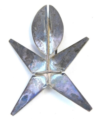 A novelty art brooch, formed as a figure on single pin back, white metal, unmarked.