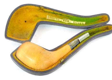 A cased meerschaum pipe, with turned wooden bowl, on white metal cap end, stamped sterling. (AF)