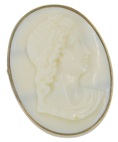 A cameo brooch, with oval cream cameo depicting maiden looking right with floral head dress, in yellow metal, unmarked, 3.5cm x 3cm, 8.9g all in.