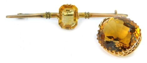 Two items of citrine set jewellery, comprising brooch with rectangular faceted citrine in basket setting, stamped 9ct, 6cm wide, and a citrine pendant in a yellow metal basket setting, with pendant loop, 2cm high, yellow metal unmarked, 9g all in. (2)