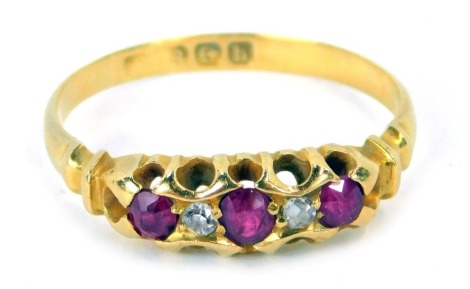 A Victorian 18ct gold ruby and diamond dress ring, set wit three oval rubies, and two old cut diamonds, each in claw setting, ring size M½, 2.6g all in, boxed.