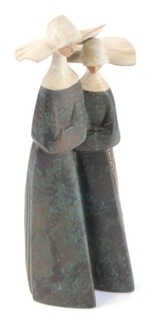 A Lladro matt porcelain figure group of a pair of nuns, in mottled blue and black, with white habits, printed mark, 34cm high.