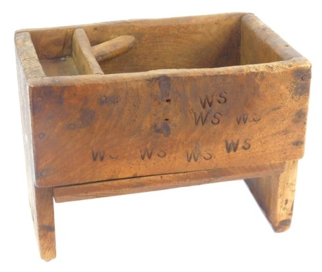 A 19thC oak blacksmith's tool box, with various stamps for WS, on stiles, 30cm high, 40cm wide, 26cm deep.