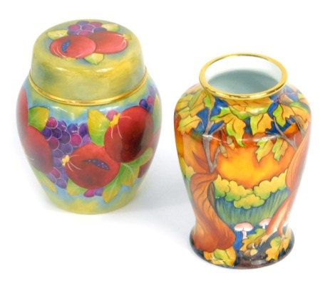 A Moorcroft Pottery miniature enamel ginger jar and cover decorated in the Pomegranate pattern, 7cm high, and a further miniature enamel vase decorated with squirrels, 7.5cm high, both boxed. (2)