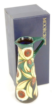 A Moorcroft Pottery jug decorated in the Albany pattern, painted and impressed marks, 23cm high, boxed.