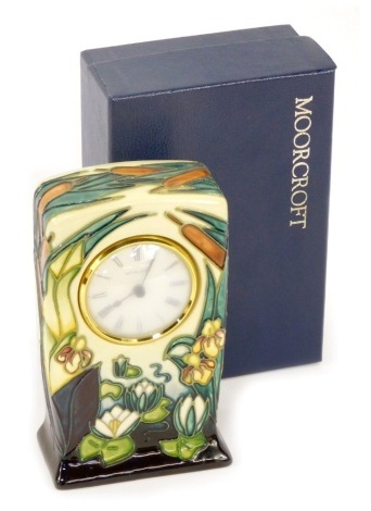 A Moorcroft Pottery clock decorated in the Lamia pattern, painted and impressed marks, 17cm high, boxed.