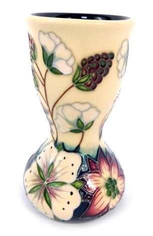 A Moorcroft Pottery vase decorated in the Bramble pattern, impressed and painted marks, 11cm high, boxed.