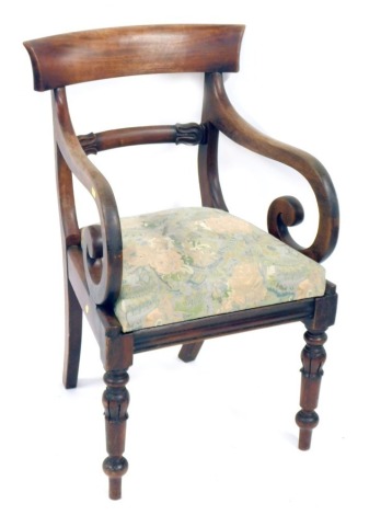 A William IV mahogany carver chair, with shaped supports and drop in floral seat.