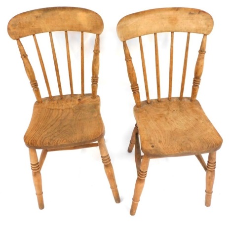 A pair of Victorian beech and elm stick back kitchen chairs, on H framed base.