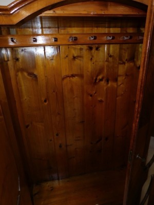 A pair of early 20thC Continental walnut double wardrobes, the arched top over a pair of paneled doors, opening to reveal hanging hooks, raised on bun feet, 180cm high, 172cm wide, 46cm deep. - 3