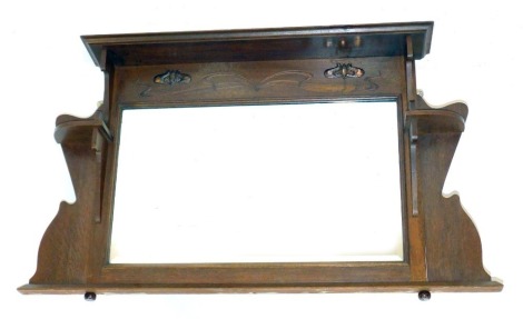 An Art Nouveau oak framed overmantel mirror, with shelf section and copper detail, 71cm high, 102cm wide, 16cm deep.