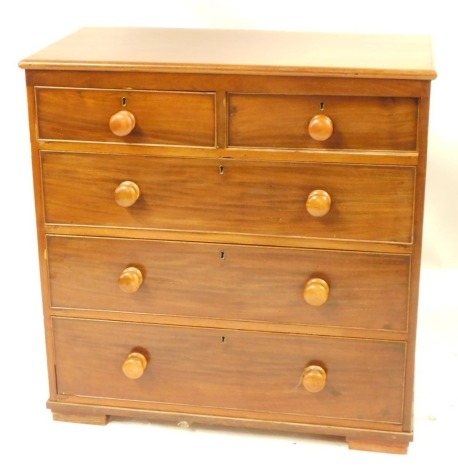 A Victorian mahogany chest, of two short and three long drawers, with wooden knop handles, on block feet, 97cm high, 96cm wide, 49cm deep.