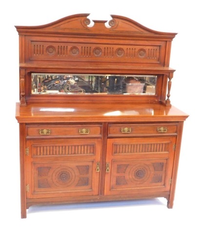 A Victorian walnut mirror back sideboard, on base with two drawers and two cupboard doors, on reeded stiles, bears label to door Holliday Son & Co, Furniture Makers, Birmingham, 195cm high, 150cm wide, 53cm deep.