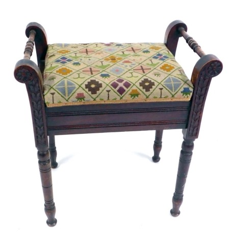 A Victorian beech piano stool, with shaped supports with carved mouldings, with tapestry seat, raised on turned legs, 61cm high, 53cm wide, 37cm deep.