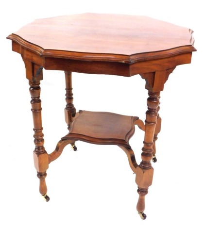 A Victorian mahogany octagonal topped window table, with fluted borders and lowered shelf, on shaped supports terminating in castors, 72cm high, the top 68cm x 68cm.