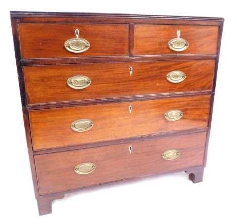 A late Georgian mahogany chest, of two short over three long drawers, with bone escutcheons and brass black back plate, swing handles, on bracket feet, 94cm high, 97cm wide, 51cm deep.