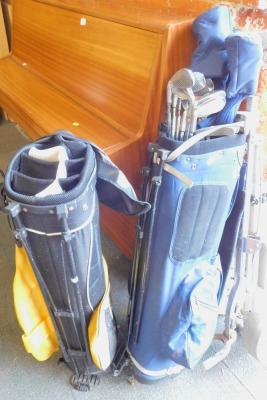 An Interceptor blue golf bag, and contents of clubs, to include Interceptor irons, The Earl Viscount Sports putter, and wheeled trolley, together with a Dunlop golf bag. (2)