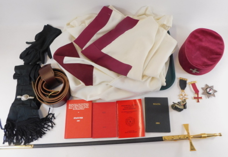 Two Masonic Knight of Malta jewels, together with a breast badge, cap, belt, tunic, sash, gloves, ceremonial sword, Knight Templar figure and books.