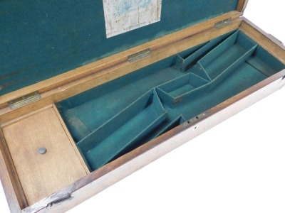 A 19thC oak cased and brass mounted J Purdey labelled gun case, the hinged lid enclosing a green felt fitted interior with an arrangement of compartments, bearing paper label to underside of lid, 90cm wide. - 6