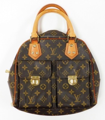 A Louis Vuitton monogram canvas Manhattan PM bag, the front with two compartments with brass monogrammed push lock clasps, the main body with a central zip enclosing a suede fitted interior, serial number FL0045, 25cm high, 25cm wide, 7cm deep, with cloth - 9