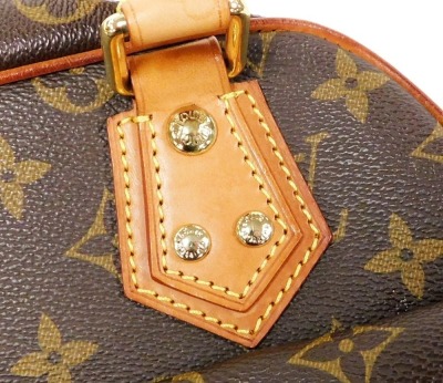 A Louis Vuitton monogram canvas Manhattan PM bag, the front with two compartments with brass monogrammed push lock clasps, the main body with a central zip enclosing a suede fitted interior, serial number FL0045, 25cm high, 25cm wide, 7cm deep, with cloth - 13