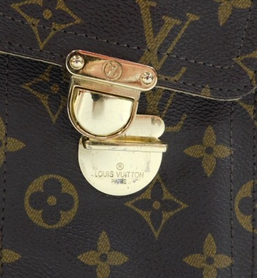 A Louis Vuitton monogram canvas Manhattan PM bag, the front with two compartments with brass monogrammed push lock clasps, the main body with a central zip enclosing a suede fitted interior, serial number FL0045, 25cm high, 25cm wide, 7cm deep, with cloth - 14