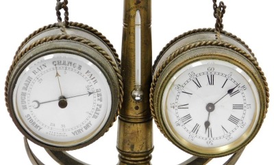 A 19thC brass nautical related combination clock and barometer, modelled in the form of a ship's anchor and two barrels, the enamel clock dial bearing Roman numerals and a subsidiary seconds dial, key wind, the centre with a mercury filled thermometer, ra - 5