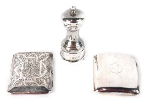 A George V silver cigarette case, by Walker and Hall, engine turned with initialled cartouche and engraved interior, Birmingham 1918, 9cm wide, a further cigarette case, and a silver pepper mill, 8.7oz all in. (3)