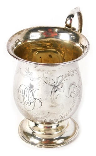 A George V silver mug, the bell shaped body with ear handle, on circular foot, Birmingham 1919, 13cm high, 3oz.