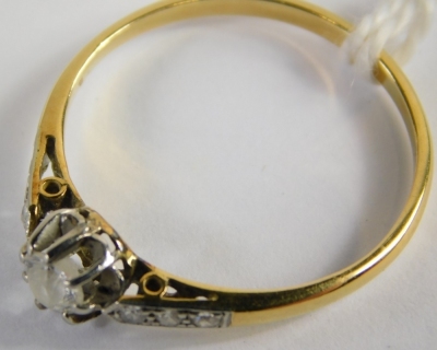 An 18ct gold diamond solitaire ring, set with central old cut diamond approx 0.15ct, in a platinum claw setting with tiny diamond set shoulders, on a yellow metal band, unmarked, ring size P½, 1.g all in. - 2